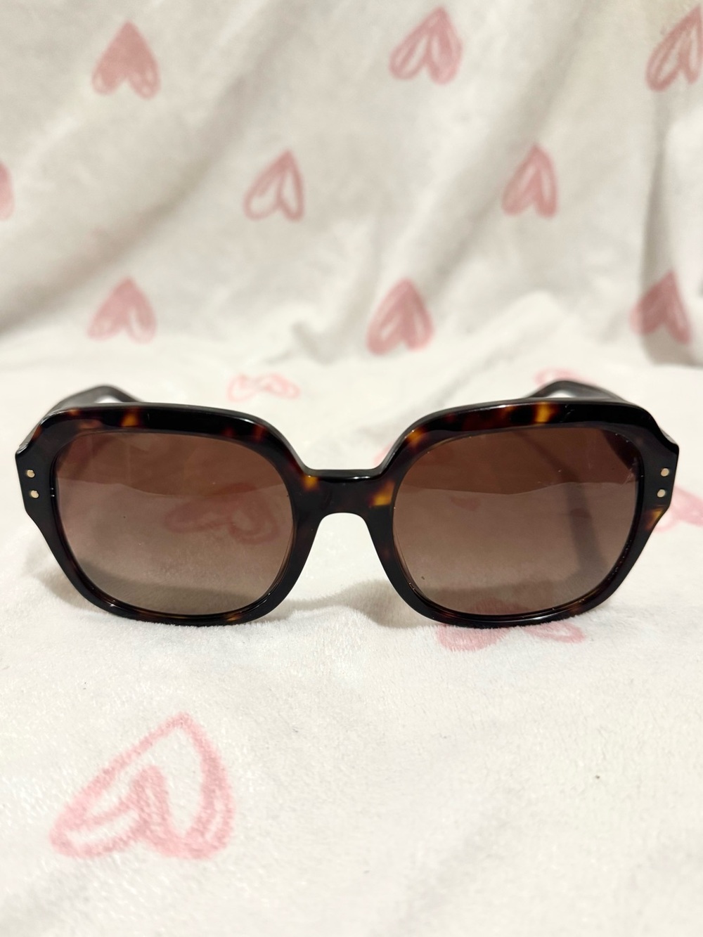 Tory Burch sunglasses with a tortoiseshell pattern